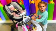 Mania doing shopping with Funny Little Baby at Toys Store